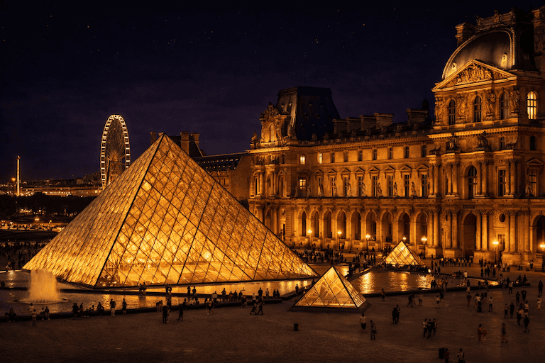 The Louvre Museum illuminated at night