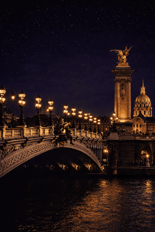 Pont Alexandre III bridge illuminated at night